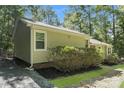 Well-maintained exterior of a single-story home featuring a side view and mature landscaping at 4937 Post Oak Ln, Rock Hill, SC 29732