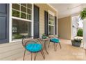 Cozy front porch with comfortable seating, providing a peaceful spot to unwind and enjoy the outdoors at 5042 Alston Dr, Lancaster, SC 29720