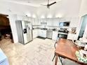 Spacious kitchen features white cabinets, stainless steel appliances, and granite countertops at 6007 Crosswood Ct, Charlotte, NC 28215