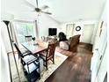 Bright living and dining area with hardwood floors, complemented by a sliding glass door at 6007 Crosswood Ct, Charlotte, NC 28215