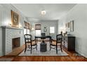 Bright living room with a decorative fireplace, hardwood floors and a neutral color scheme at 772 Eden Ter, Rock Hill, SC 29730