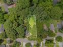 Aerial view of a large property, surrounded by mature trees at 822 Cantwell St, Charlotte, NC 28208