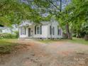 View of a cozy single-story home with a spacious yard at 822 Cantwell St, Charlotte, NC 28208