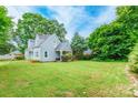 Inviting two-story home with a lush green lawn and mature trees around the perimeter at 904 Venus St, Kannapolis, NC 28083