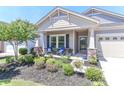 Welcoming front porch with cozy seating and decorative plants, creating a warm entrance to the home at 9541 Festival Way, Charlotte, NC 28215