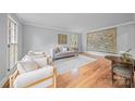 Bright living room with hardwood floors, neutral walls, and comfortable seating at 10918 Megwood Dr, Charlotte, NC 28277