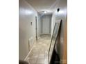 Neutral hallway features tile flooring and multiple entryways at 1250 Landsdowne Dr, Conover, NC 28613