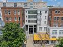 Condo building featuring brick and modern architecture with a prominent entrance under 'The Dilworth' sign at 1315 East Blvd # 327, Charlotte, NC 28203