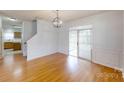 Dining room with hardwood floors and sliding glass doors at 15280 Leslie Brook Rd, Huntersville, NC 28078