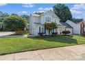 Lovely two-story house with a blue door, an attached garage, and a well-kept lawn at 15280 Leslie Brook Rd, Huntersville, NC 28078