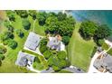 Stunning aerial view showcases a sprawling estate with lush landscaping and waterfront proximity at 174 Hickory Hill Rd, Mooresville, NC 28117