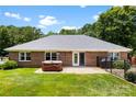 Relaxing backyard with a hot tub, well maintained yard, and privacy fence at 1958 Cameron Heights Cir, Denver, NC 28037