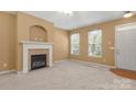 Comfortable living room with neutral walls, modern ceiling fan and cozy fireplace at 212 Township Dr, Fort Mill, SC 29715