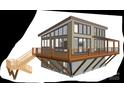 Modern two-story home with a spacious deck and large windows, offering ample natural light at 3565 Big Timber Dr, Sherrills Ford, NC 28673