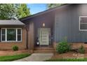 Welcoming front entrance with modern door, brick accents, and fresh landscaping at 3701 Table Rock Rd, Charlotte, NC 28226