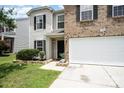 Traditional two-story home featuring brick and siding exterior, well-manicured front lawn, and a two-car garage at 4068 Sherri Ln, Fort Mill, SC 29715