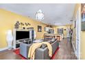 Open-concept living space with modern furnishings, wood floors, and abundant natural light at 460 Clouds Way, Rock Hill, SC 29732