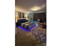Comfortable main bedroom with accent lighting, plush carpeting and decorative wall art at 5707 S Rocky River Rd, Monroe, NC 28112