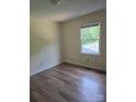 Bright bedroom with hardwood floors and a window offering natural light and views at 608 Sharon Dr, Statesville, NC 28625