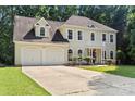 Charming traditional home with a two-car garage, manicured lawn, and covered front entrance at 7151 Plough Dr, Mint Hill, NC 28227