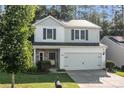 Charming two-story home featuring a two-car garage and a combination of stone and siding at 2532 Blue Moss Dr, Dallas, NC 28034