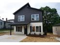 Stylish two-story home with a sleek, modern design and a covered front entrance at 258 Lincoln Sw St, Concord, NC 28025