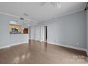Bright living room featuring hardwood floors, neutral paint, and an open layout with kitchen views at 300 W 5Th St # 617, Charlotte, NC 28202