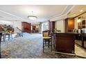 Elegant community lounge with a full bar and plush seating, perfect for entertaining guests at 300 W 5Th St, Charlotte, NC 28202
