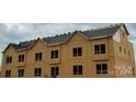 New townhomes with exposed framing highlighting the construction progress, roofing materials, and development in progress at 3023 Casting St # 7, Charlotte, NC 28206