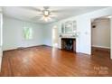 Bright living room boasting hardwood floors, fireplace, and ample natural light at 310 E Houston St, Monroe, NC 28112