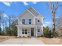 Beautiful home featuring a classic design, manicured lawn, and an inviting entrance at 318 Sixth St, Belmont, NC 28012