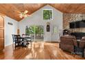 Bright living room featuring wood floors, vaulted ceilings and a stone fireplace at 360 Lake Landing Dr, Salisbury, NC 28146