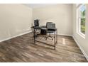 A bright office space with wood-look floors, perfect for a home office or study at 473 Wendover Dr, Salisbury, NC 28147