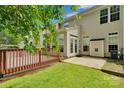 Backyard features a wood deck, concrete patio, and green lawn at 6000 Boathouse Ln # C, Cramerton, NC 28032