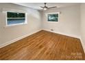 Bedroom featuring hardwood floors and natural light from large windows at 7812 Old Concord Rd, Salisbury, NC 28146