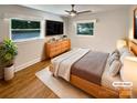 Bright bedroom with hardwood floors, ceiling fan, and natural light at 7812 Old Concord Rd, Salisbury, NC 28146