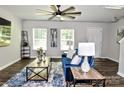 Open living room features hardwood floors, elegant decor, and plenty of natural light at 8388 Waxhaw Hwy, Waxhaw, NC 28173
