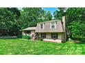 Charming home featuring a brick exterior, well-manicured lawn, and mature trees at 121 Pelham Ln, Fort Mill, SC 29715