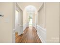 Inviting foyer with hardwood floors, an arched window, and neutral paint at 14103 Hiawatha Ct, Huntersville, NC 28078