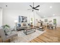 Bright living room with modern decor, vaulted ceilings, and an open floor plan at 3100 Hickory Grove Dr, Monroe, NC 28110