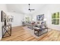 Spacious living room featuring wood flooring, neutral colors and ample natural light at 3100 Hickory Grove Dr, Monroe, NC 28110