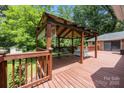 Charming gazebo on the backyard deck with seating, perfect for relaxation at 324 Swamp Fox Dr, Fort Mill, SC 29715