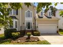 Beautiful two-story home featuring a manicured lawn and welcoming front entry at 4519 Rock Stream Dr, Charlotte, NC 28269