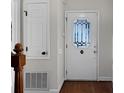 Bright entryway featuring a decorative front door and white trim, leading into the home's interior at 6017 Millbury Ct, Charlotte, NC 28211