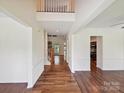Bright foyer showcasing hardwood floors and a grand staircase at 7309 Rock Hampton Ct, Harrisburg, NC 28075