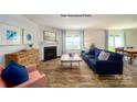 Cozy living room with a fireplace, comfortable seating, and bright natural light at 1046 Horizon Ln, Chester, SC 29706