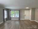 Bright living room with new floors and large windows at 107 Ameena Chase Trl, Mooresville, NC 28117
