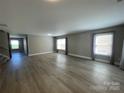 Open-concept living area with abundant natural light at 107 Ameena Chase Trl, Mooresville, NC 28117