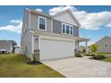 Two-story home featuring gray siding, a two-car garage, and a well-maintained lawn at 120 Parson Ln, Statesville, NC 28625