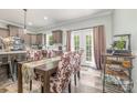 An airy dining area adjacent to the kitchen, with patio doors providing natural light and outdoor views at 1870 Hwy 49 None, New London, NC 28127